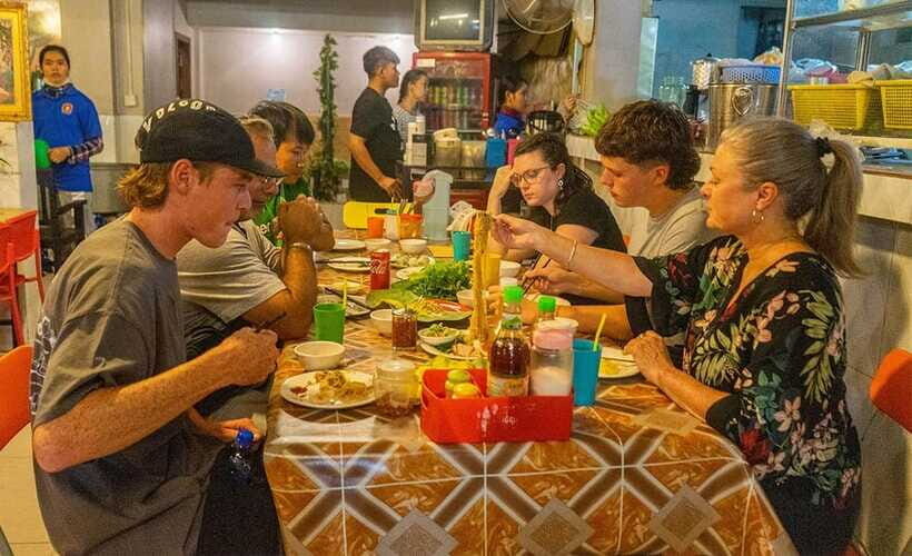 Phnom Penh: Night Foodie Tour by Tuk Tuk with Drinks - Russian Market after dark: BBQ chicken, pork ribs, and dessert