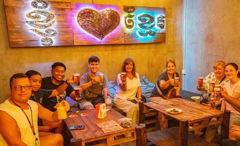 Phnom Penh: Night Foodie Tour by Tuk Tuk with Drinks - Romdeng Restaurant start and the riverfront warm-up